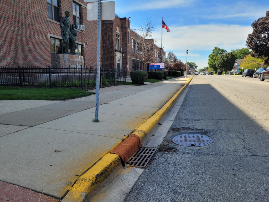 Inlet protection at a curbside storm drain along 16th Street.